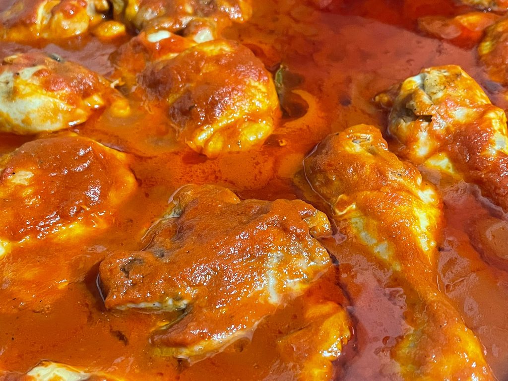 Italian chicken stew with tomato sauce, red wine and bay leaf