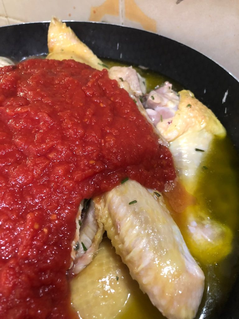 Italian chicken stew with tomato sauce, red wine and bay leaf
